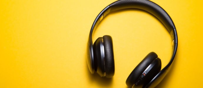 flatlay photography of wireless headphones