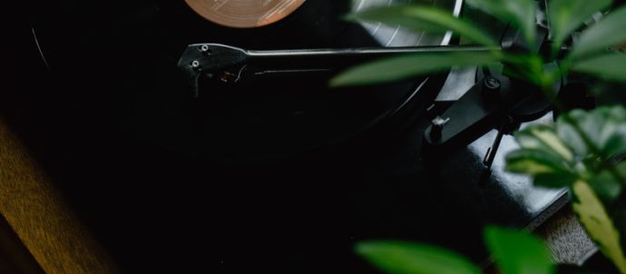 black turntable on brown wooden table